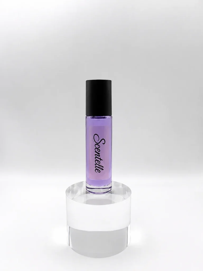 Scentelle 1/3 oz roll-on perfumed body oil in a tall glass bottle with purple liquid and a black cap.