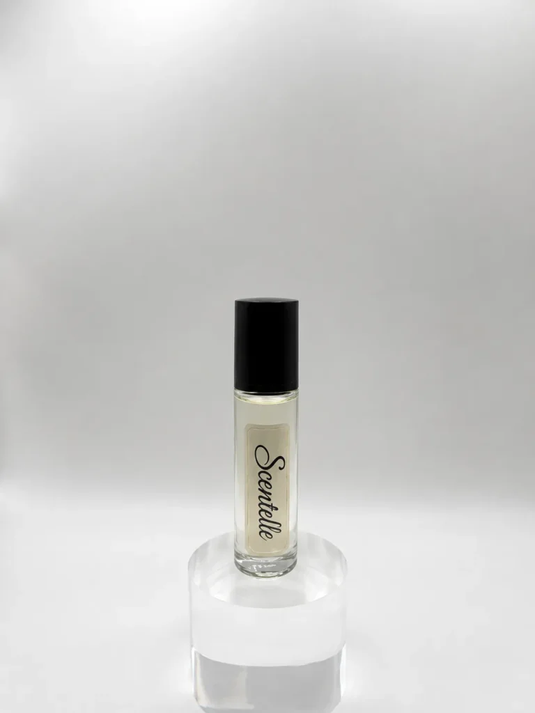 Scentelle 1/3 oz roll-on perfumed body oil in a tall glass bottle with clear liquid and a black cap.